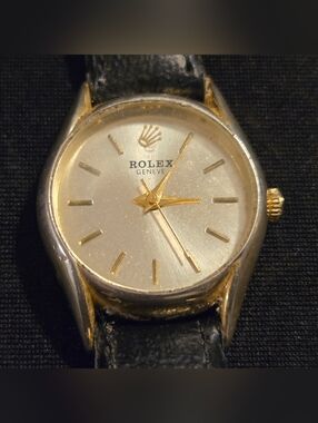 Rolex Silver Dial Watch with Gold Accents and Black Strap